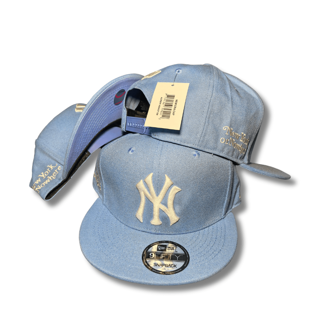 New York Yankees with Cream Embroidered Logo and Script Detail Light Blue – Snapback Cap